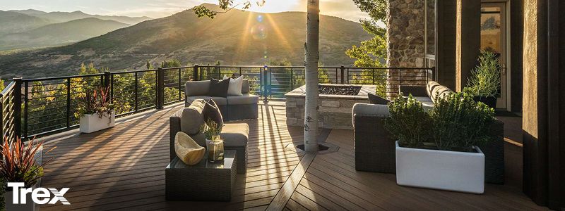 deck with metal railing and outdoor furniture